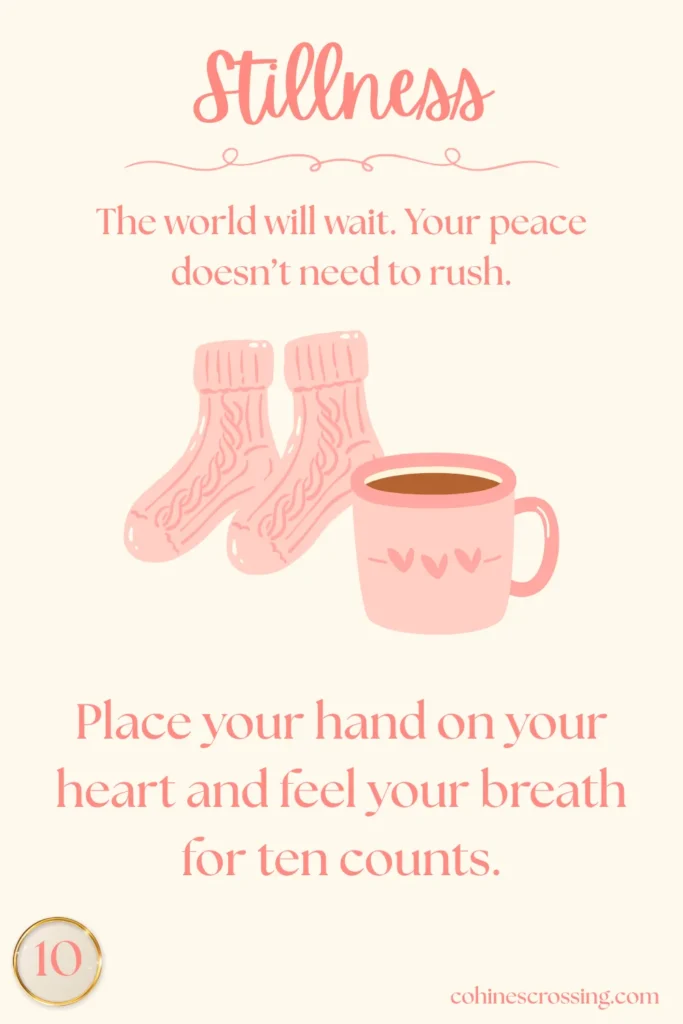 An oracle card with the word “stillness” and a thought and action step with a cozy pair of socks and a cup of coffee