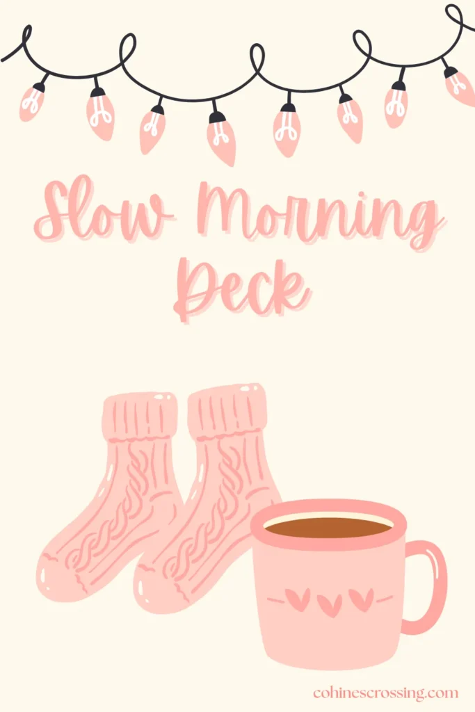 A digital oracle card deck cover with the words “slow morning deck” and an illustration of a cozy pair of pink socks and a pink coffee mug with pink string lights